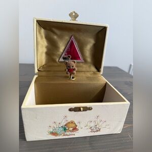 Vintage musical jewelry box
Flocked teddy bear spins while music plays